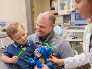 Father and son at child's first dentist appointment